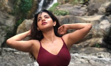 Captivating curvy beauty Actress IswaryaMenon sizzles in this latest photoshoot shot at a waterfall