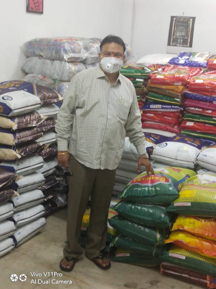 Film producer of vels film international Ishari k Ganesh contributing rice bags 