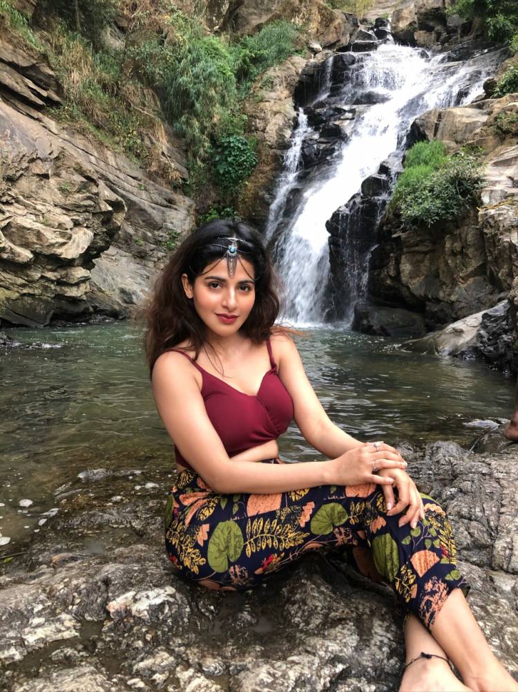 Captivating curvy beauty Actress IswaryaMenon sizzles in this latest photoshoot shot at a waterfall